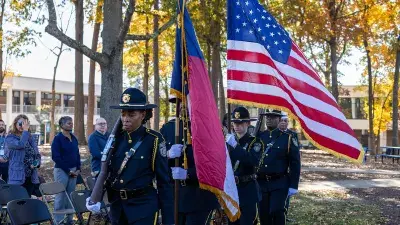 The Wake Tech Honor Guard presents the colors during a ceremony honoring military service members, veterans and their families.